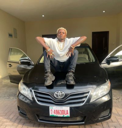 Buzzing Singer, Portable Lands New Car NotjustOK