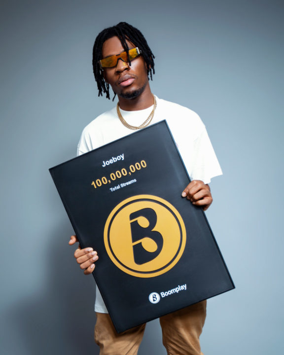 Joeboy with a Boomplay plaque