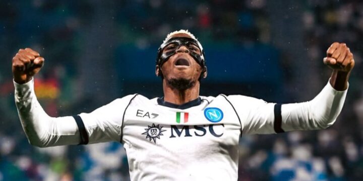 Victor Osimhen in Napoli's white away jersey celebrating his goal for the club