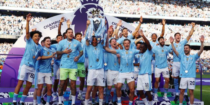 Manchester City players lifting their fourth consecutive Premier League trophy