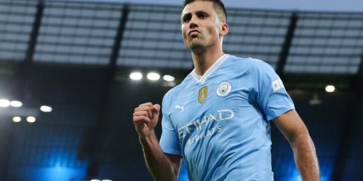 Spain midfielder Rodri celebrating his goal for his club Man City in their home jersey