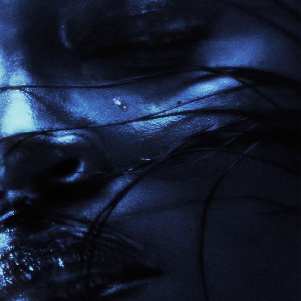 The cover art for "Sweeeet" by Amaarae features a close-up, dimly lit image of a person's face, partially obscured by dark strands of hair. The image is tinted in shades of blue, giving it a moody and ethereal feel. The person's eyes are closed, and their lips are slightly parted, creating an intimate and introspective atmosphere. The overall effect is dreamy and mysterious, drawing the viewer into the subtle emotions conveyed in the artwork.