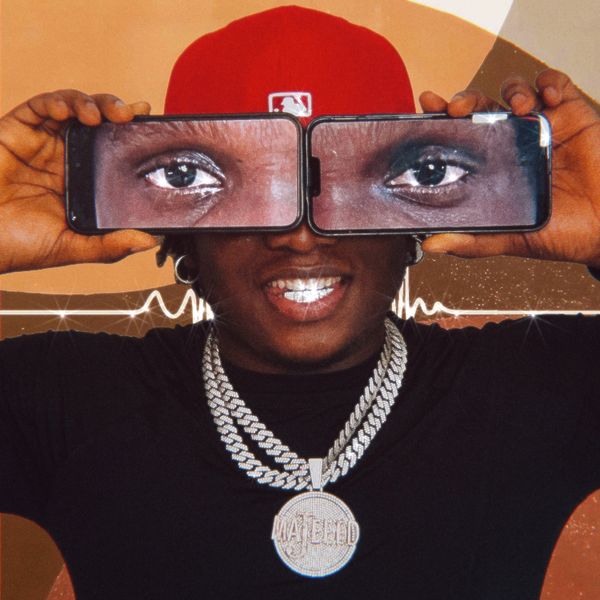The cover art for California by Majeed features a man wearing a red baseball cap, large silver chains, and a black shirt. He is smiling broadly, showing off his shiny grill. The most striking feature of the image is that he holds two smartphones in front of his eyes, each displaying a close-up image of his eyes, creating a surreal and humorous effect. Behind him, a waveform graphic stretches horizontally across the image, adding a dynamic, audio-related element to the artwork. The overall vibe is playful and modern, with a mix of street style and digital culture.