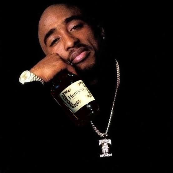 2Pac Shakur Holding a bottle of Hennessy